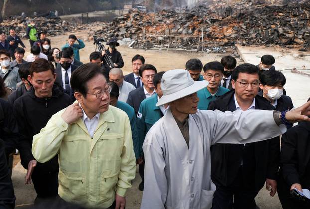 Lee Jae-myung, leader of South Korea's main opposition Democratic Party, visits the devastated Gounsa temple in Uiseong