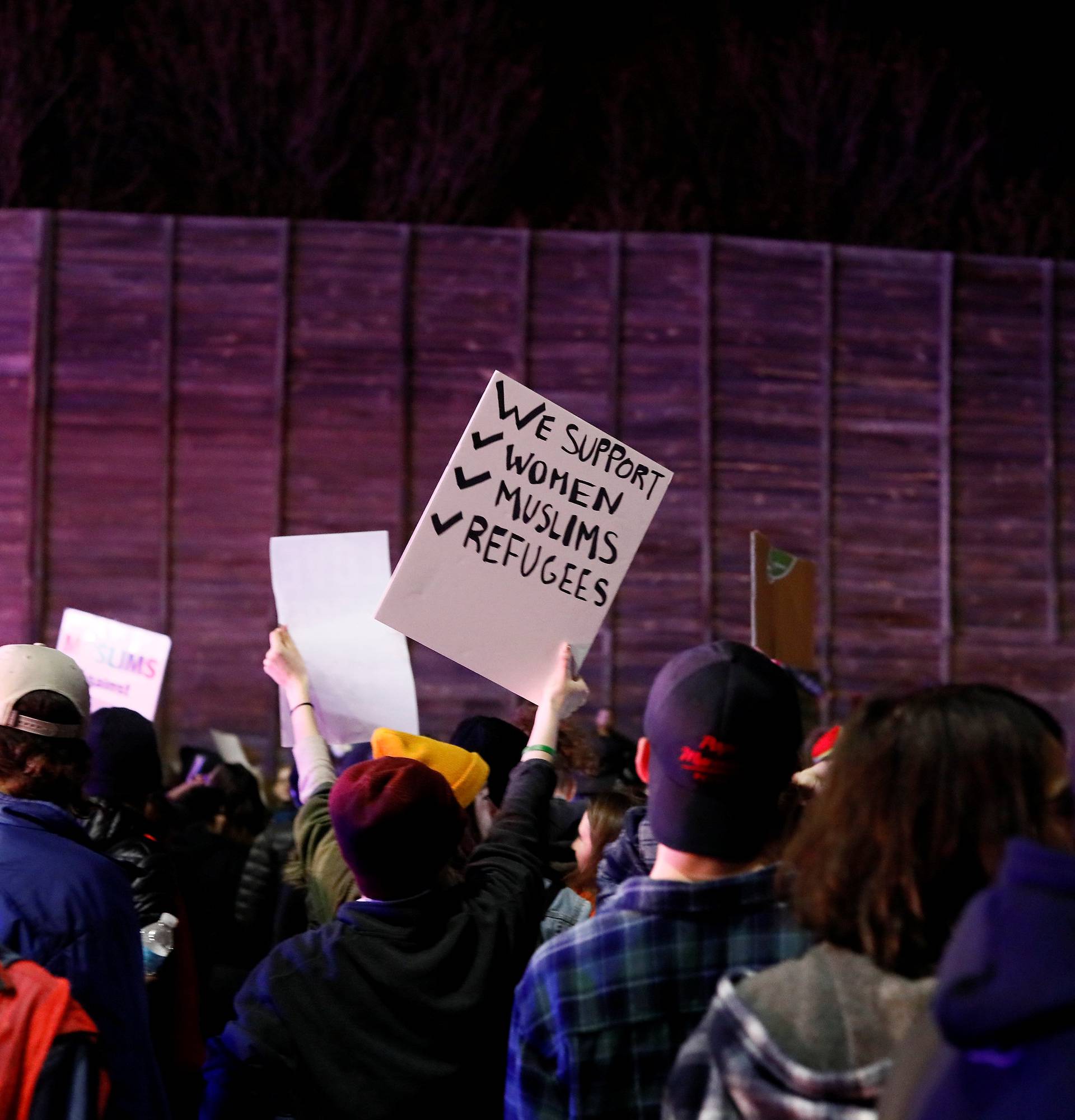 Demonstrators march as they shout slogans against President-elect Donald Trump in Minneapolis