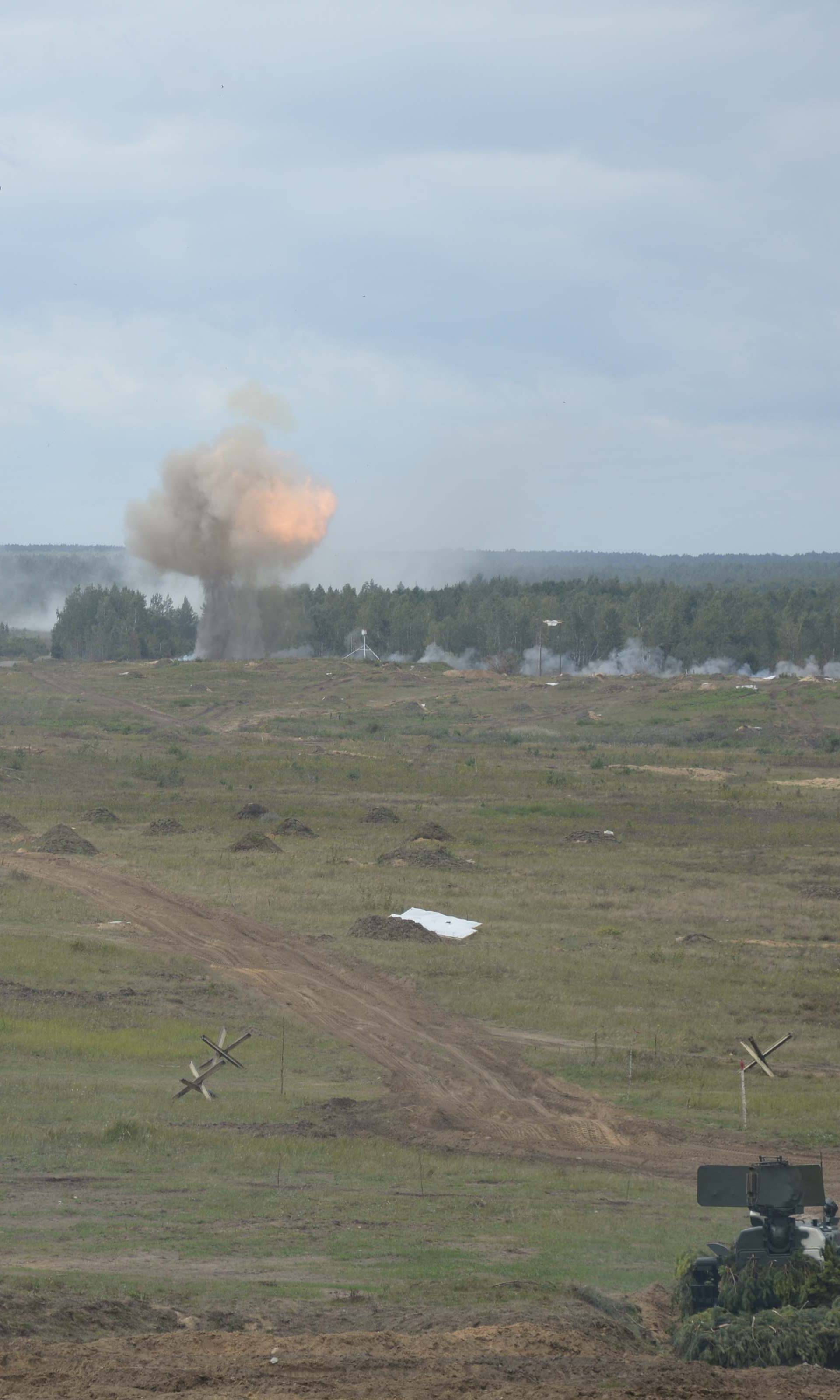 Armoured vehicles fire during the Zapad-2017 war games in Belarus