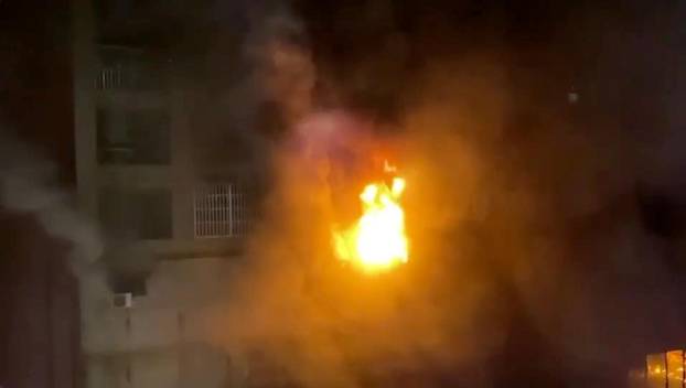 Smoke is seen as a fire blazes at Cheng Chung Cheng building in Kaohsiung, Taiwan in this still frame obtained from social media video