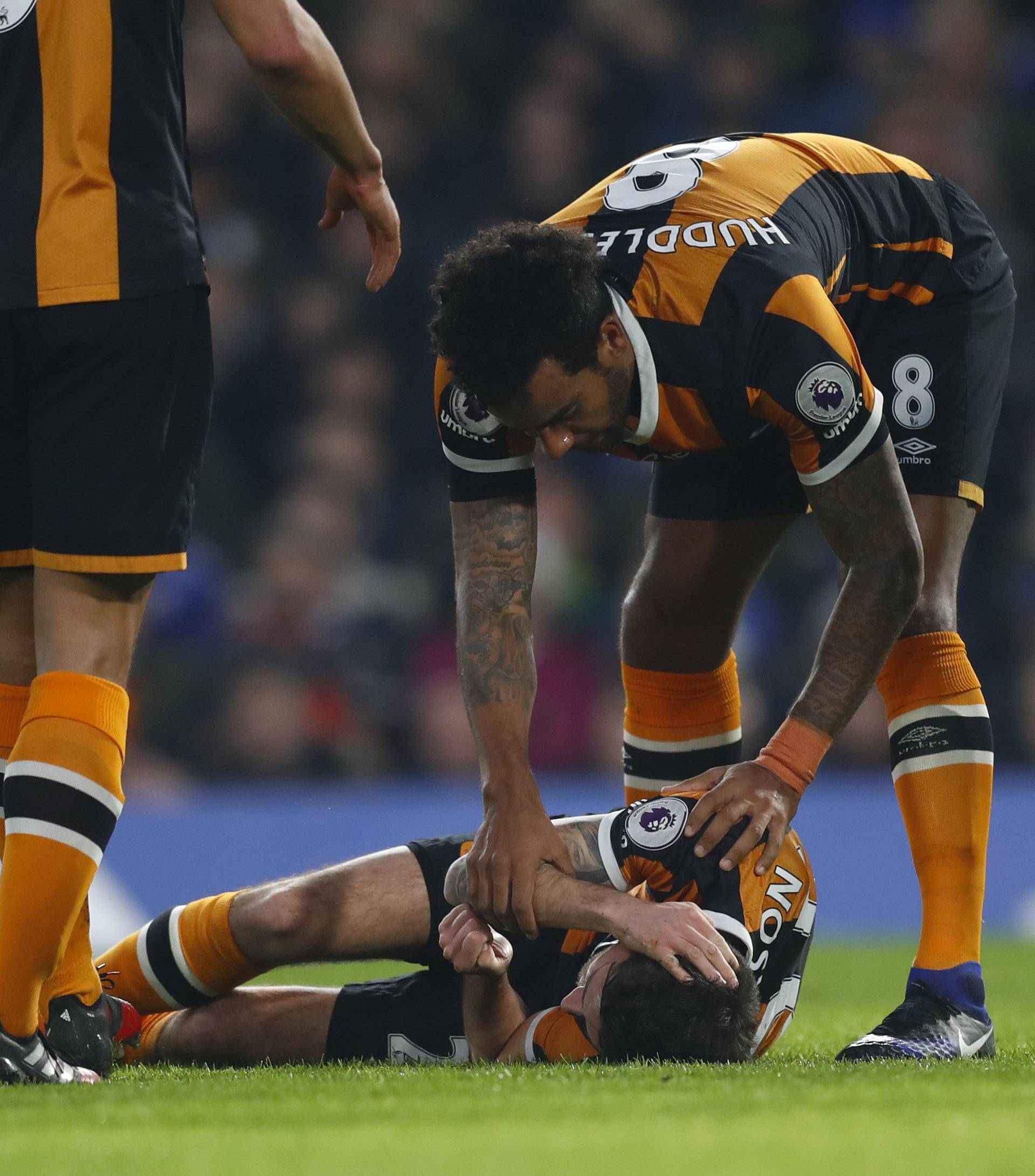 Hull City's Ryan Mason lies injured