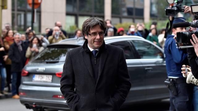 Carles Puigdemont arrives for a news conference in Brussels