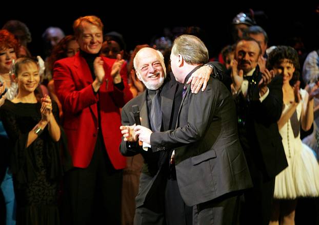 FILE PHOTO: Director Harold Prince and composer Andrew Lloyd Webber greet one another during the curtain call of 