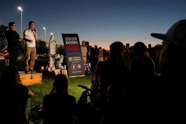 Catholics from across the Phoenix area gather to pray for Charlie Kirk, who was shot and killed in Utah, at Desert Horizon Park in Scottsdale