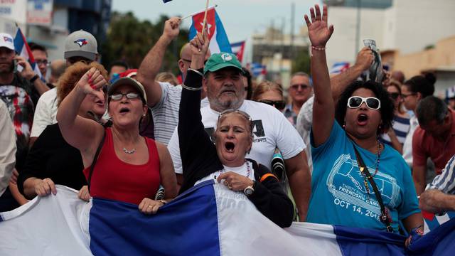 People celebrate after the announcement of the death of Cuban revolutionary leader Fidel Castro in the Little Havana district of Miami