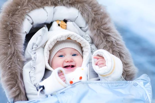 Happy,Laughing,Baby,Girl,Enjoying,A,Walk,In,A,Snowy