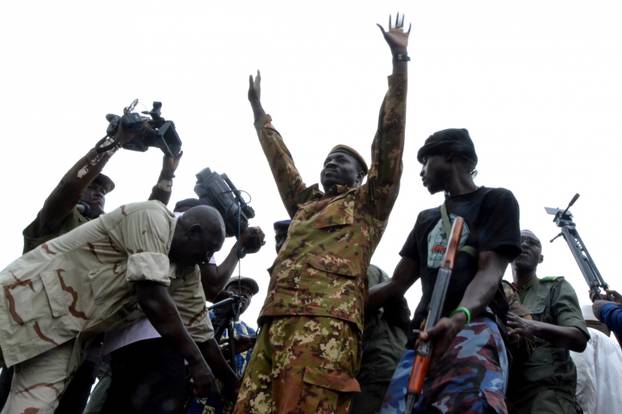 Colonel Kone of CNSP waves as he attends a mass rally to celebrate the coup at the Independence Square in Bamako