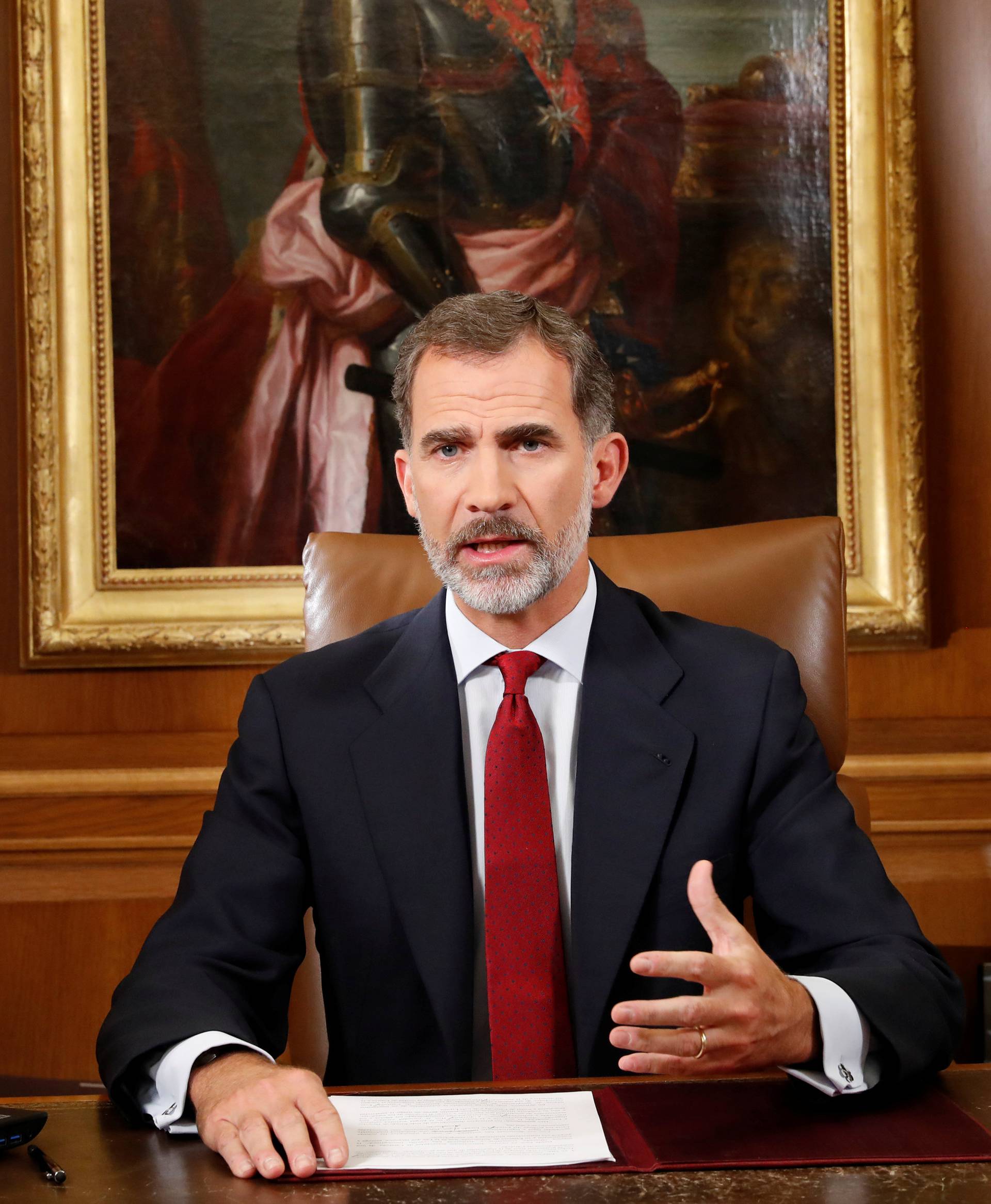 Spain's King Felipe gestures as he make an statement at Zarzuela Palace in Madrid