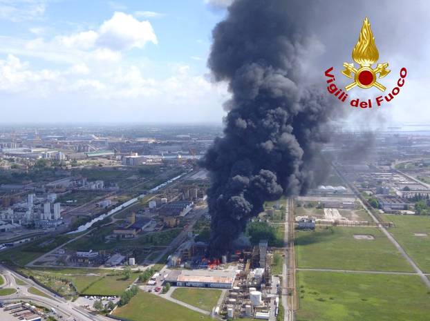 Large clouds of black smoke billow from a chemical plant after an explosion, in Marghera, near Venice