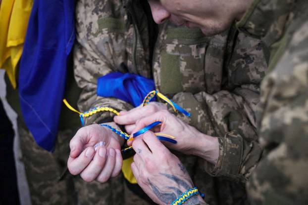 Ukrainian POWs are seen after a swap at an unknown location in Ukraine