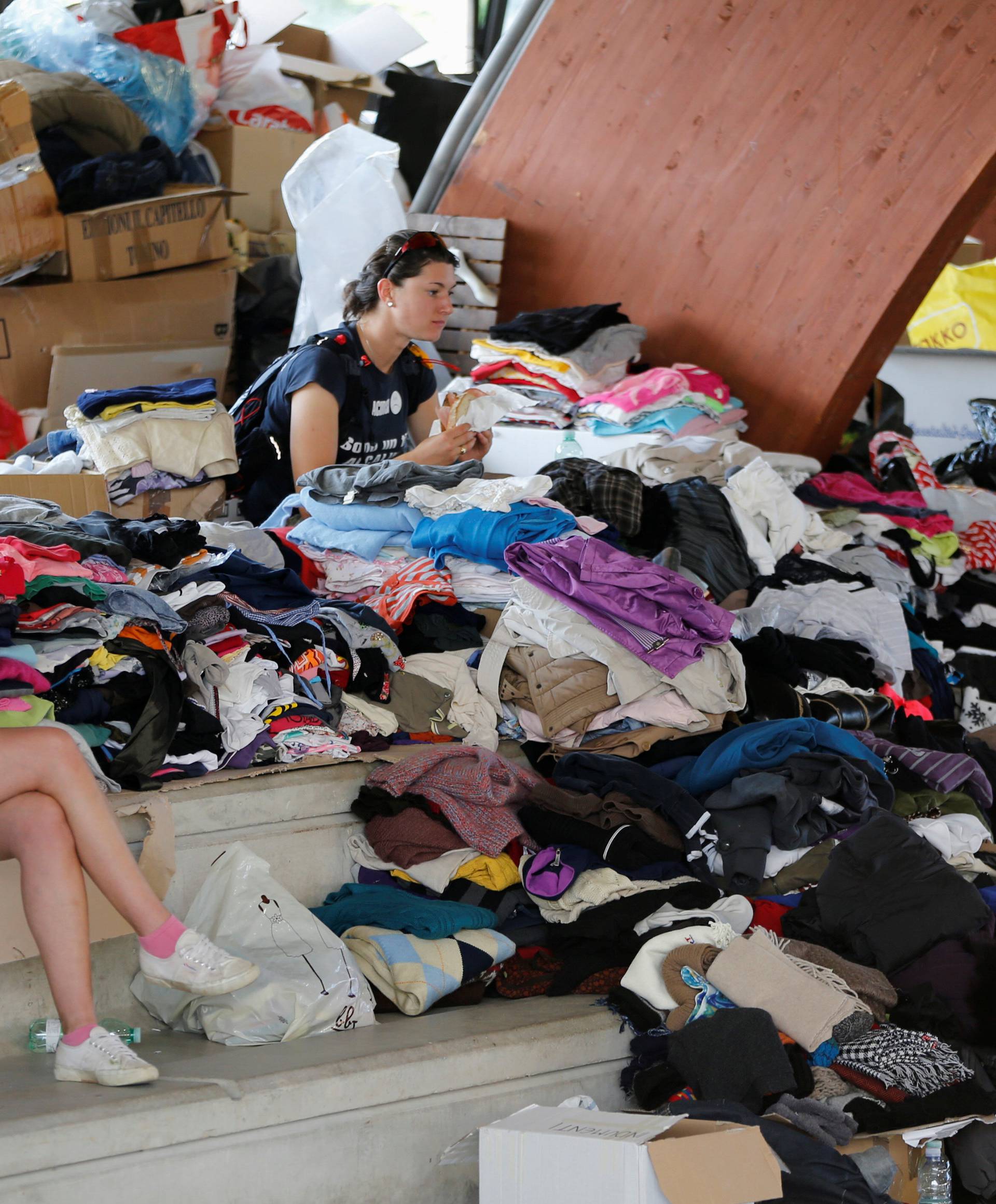 Clothes are packaged to be distributed in a gym following an earthquake in Amatrice