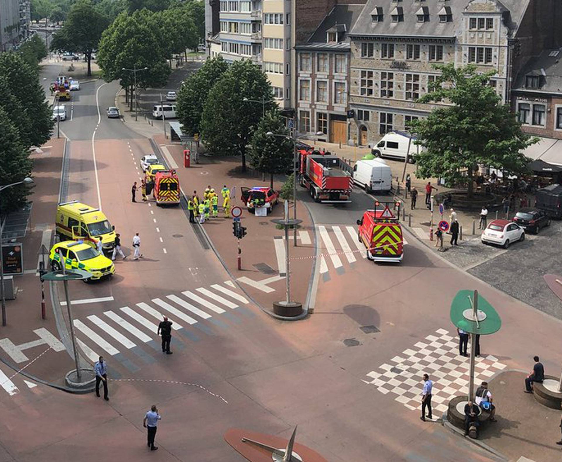 Emergency responders are seen following a shooting in Liege