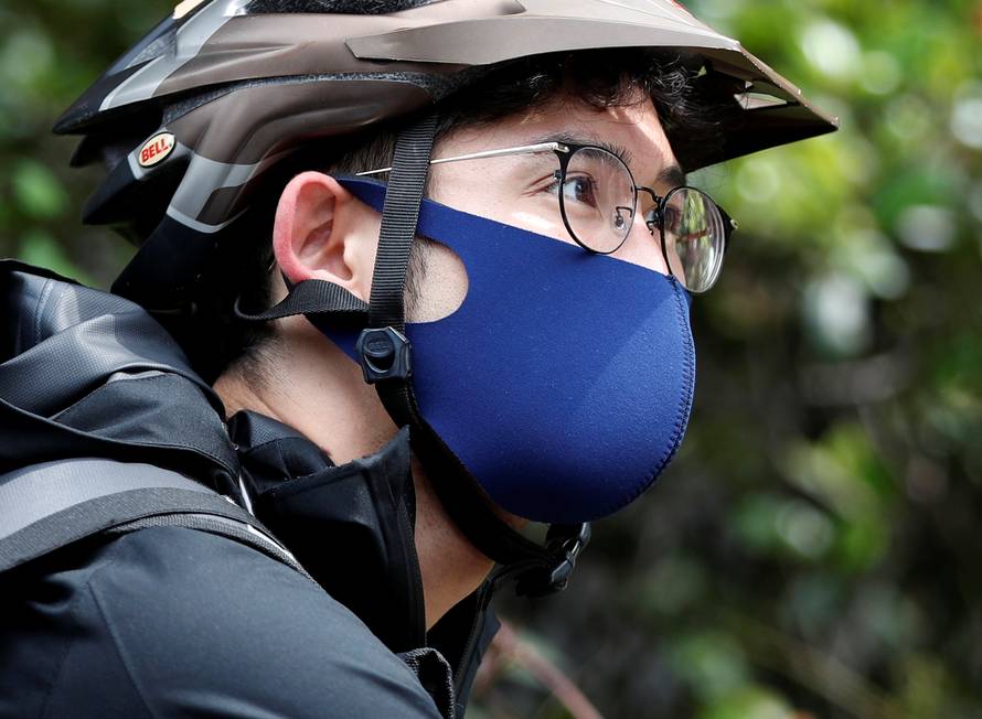  Japan's Olympic fencing medallist Ryo Miyake works his part-time job as Uber Eats delivery person as the spread of the coronavirus disease (COVID-19) continues in Tokyo