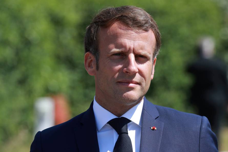 French President Emmanuel Macron visits a factory of manufacturer Valeo, in Etaples
