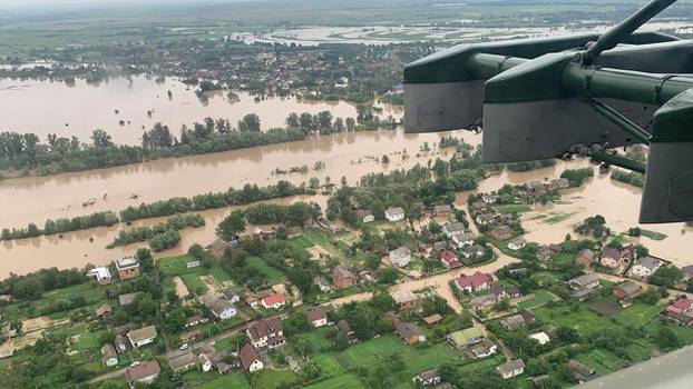 An aerial view shows flooded residential buildings in Ivano-Frankivsk region