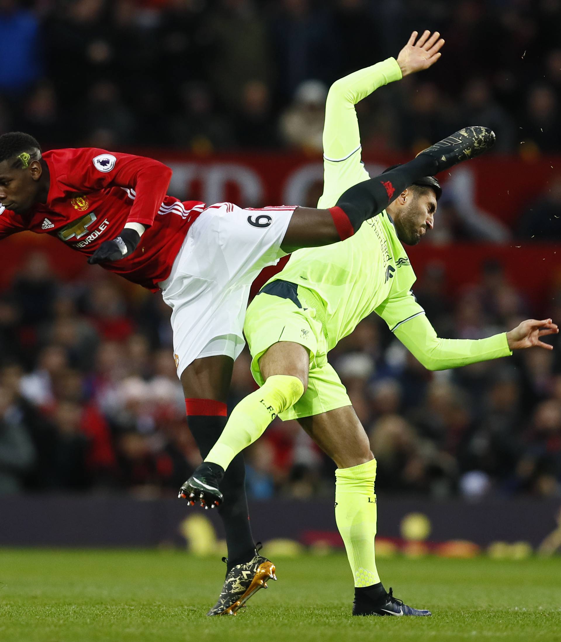 Manchester United's Paul Pogba in action with Liverpool's Emre Can