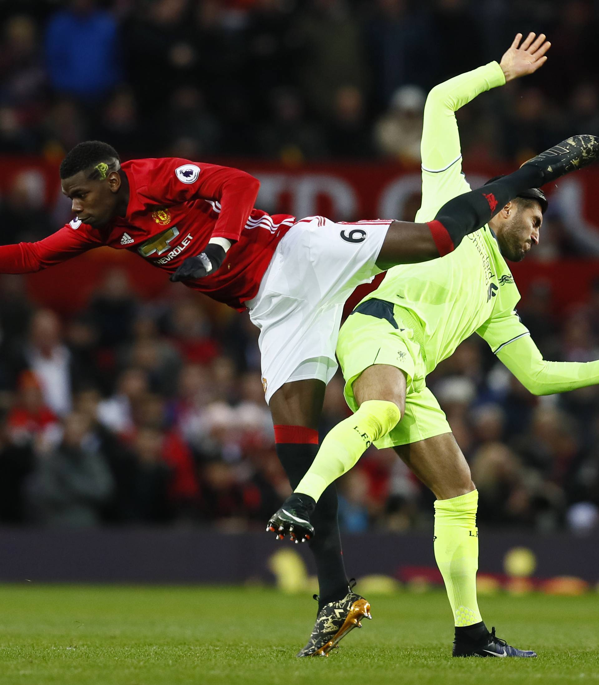 Manchester United's Paul Pogba in action with Liverpool's Emre Can