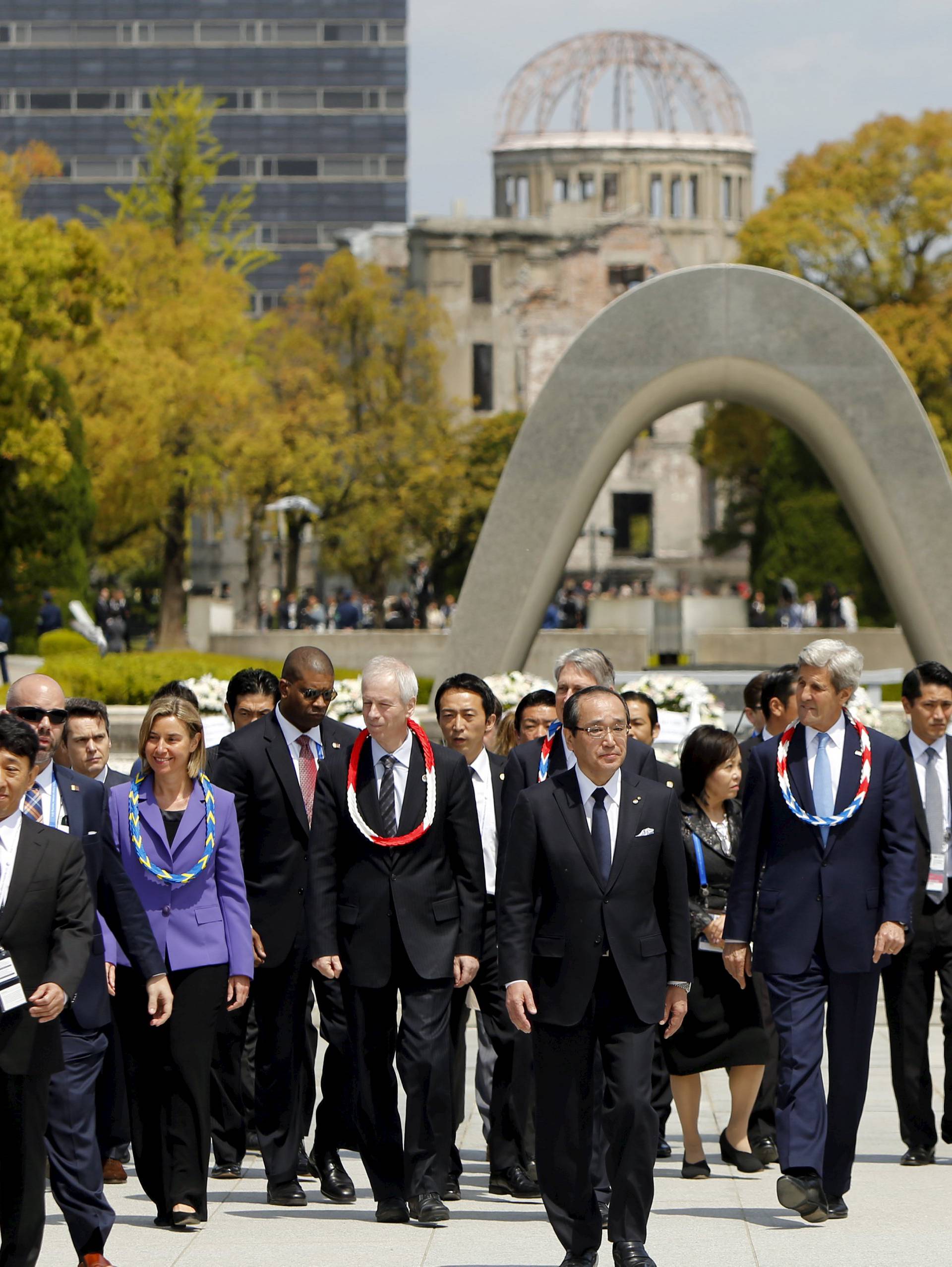 G7 foreign ministers walk together after placing wreaths at the cenotaph at Hiroshima Peace Memorial Park and Museum in Hiroshima, Japan