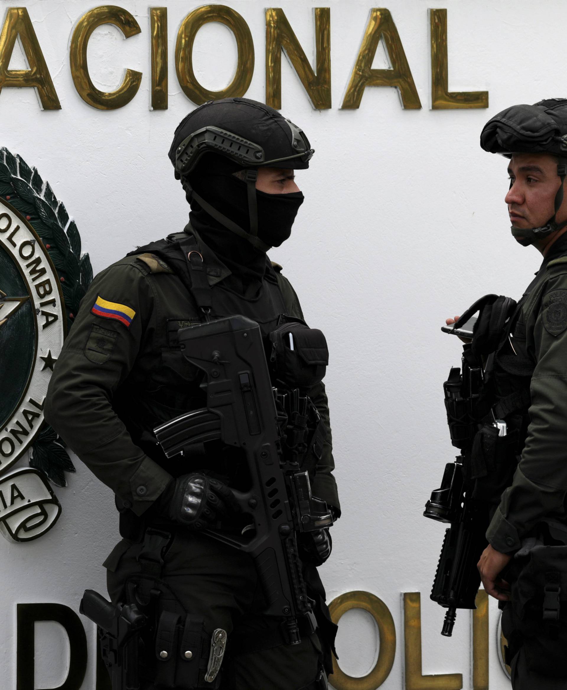 Police work close to the scene where a car bomb exploded, according to authorities, in Bogota