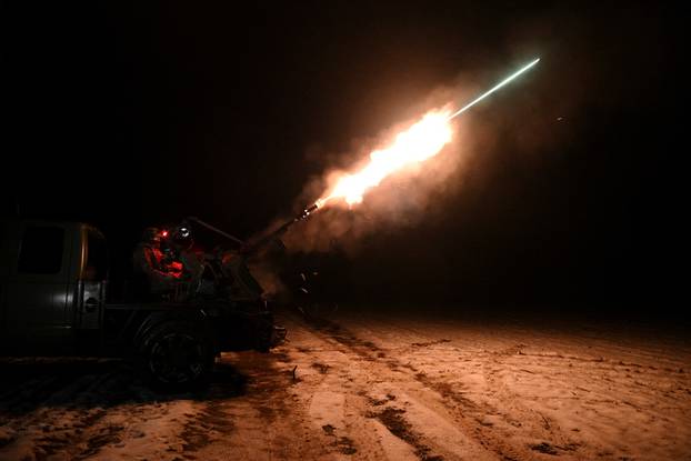 A Ukrainian serviceman from anti-drone mobile air defence unit fires a ZU-23-2 anti-aircraft cannon during combat in Chernihiv region