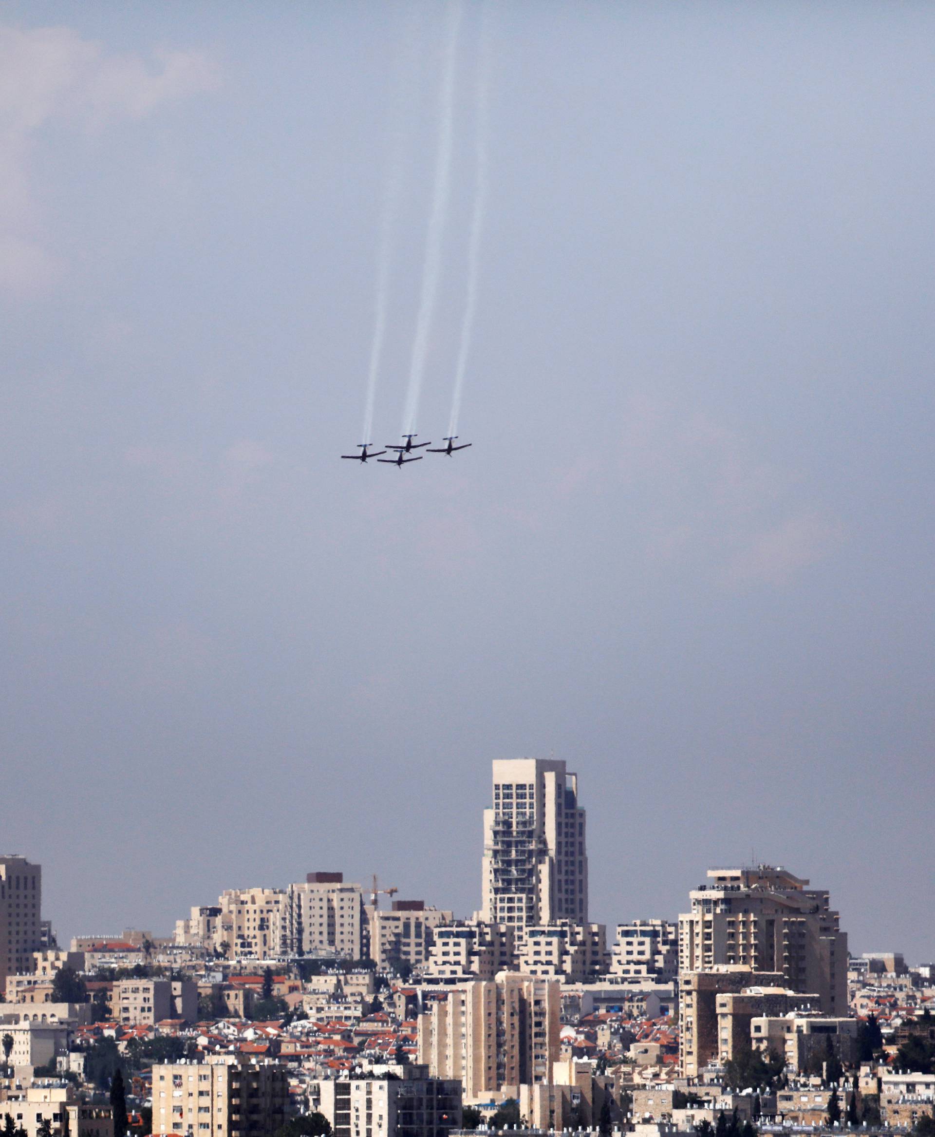 An Israeli Air Force aerobatic team flies in formation during a rehearsal for an aerial show for Israel's 70th Independence Day celebrations, in Jerusalem
