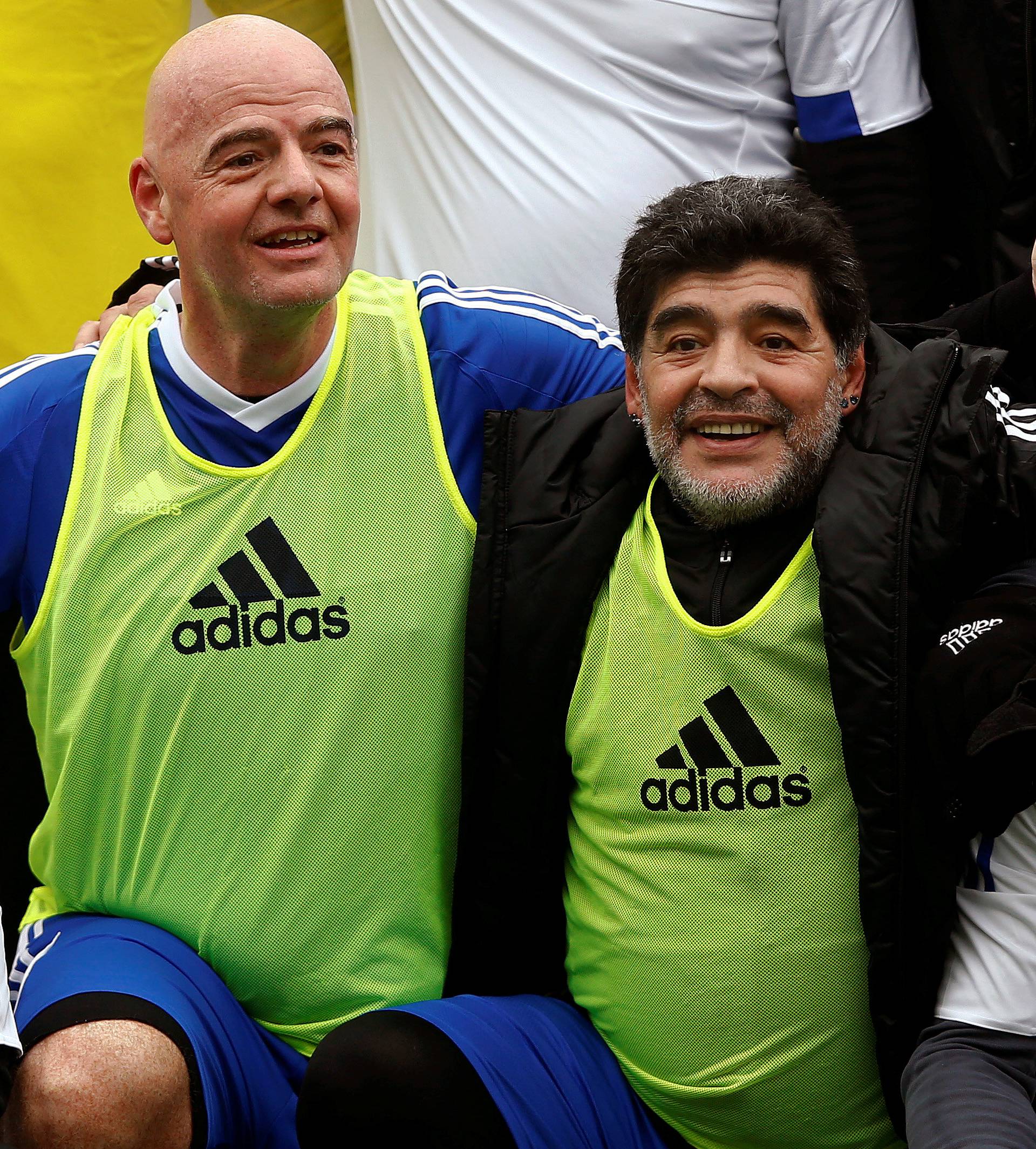 Maradona and FIFA President Infantino pose with team members after the FIFA Legends tournament in Zurich