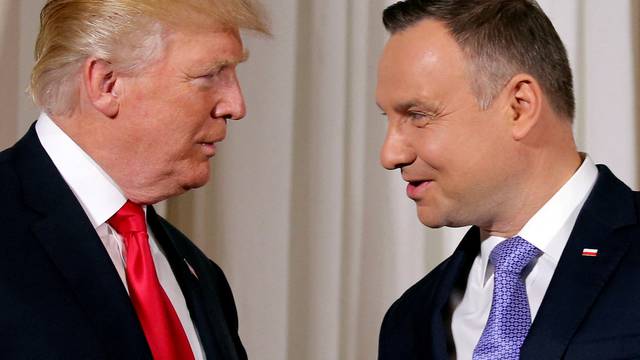 FILE PHOTO: U.S. President Donald Trump is greeted by Polish President Andrzej Duda in Warsaw