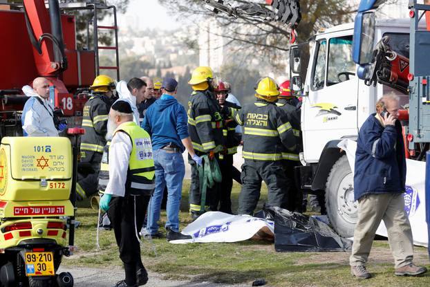 Israeli rescue forces work at the scene of a truck ramming incident in Jerusalem