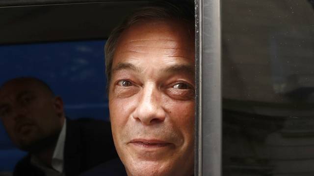 Nigel Farage, the leader of the United Kingdom Independence Party looks out of a car window as he leaves following the EU referendum vote, in central London