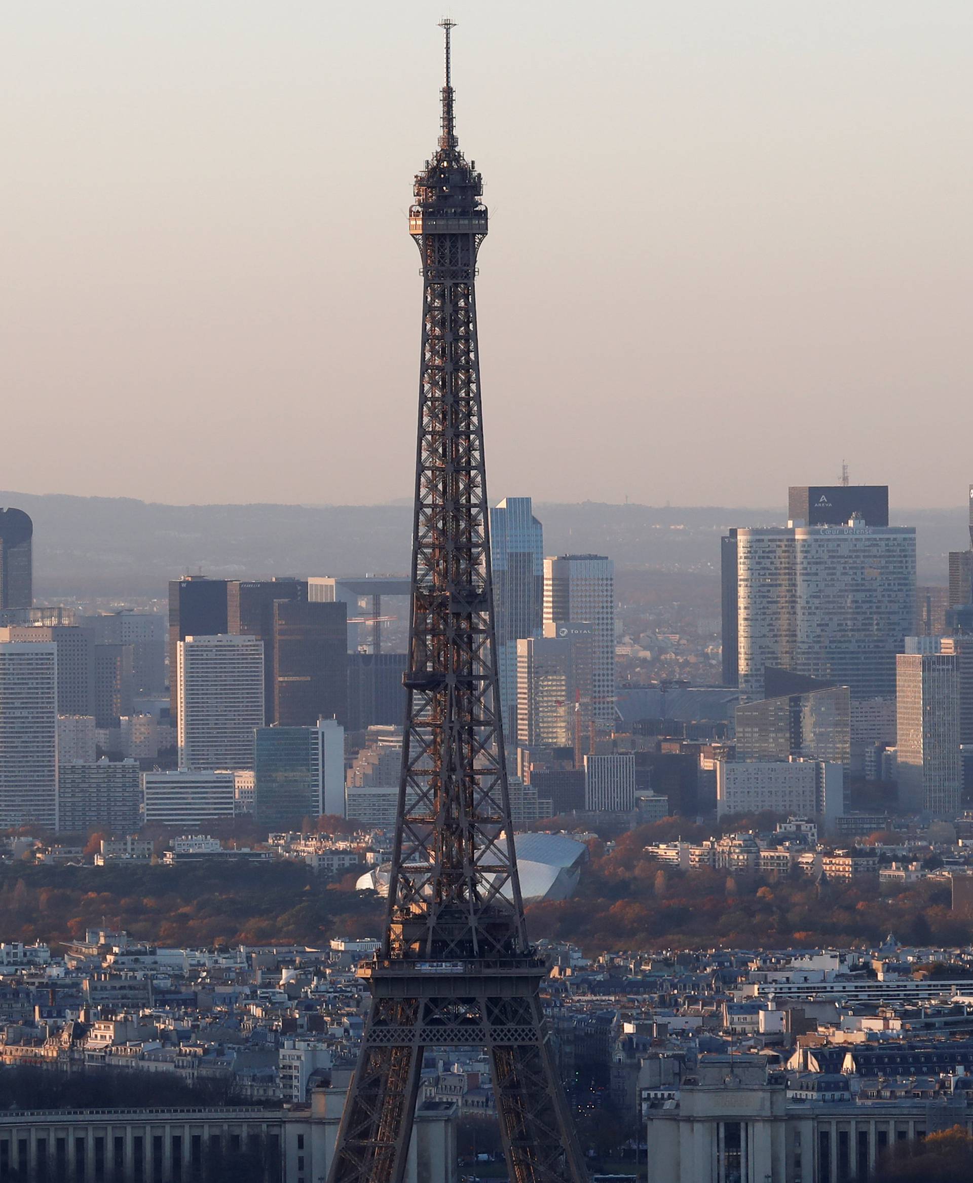 FILE PHOTO - A general view shows the Eiffel Tower and the financial and business district in La Defense, west of Paris