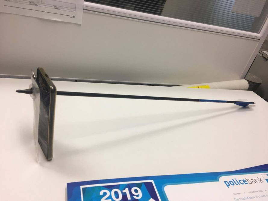 A picture shows an arrow that pierced a mobile telephone after accident in Nimbin