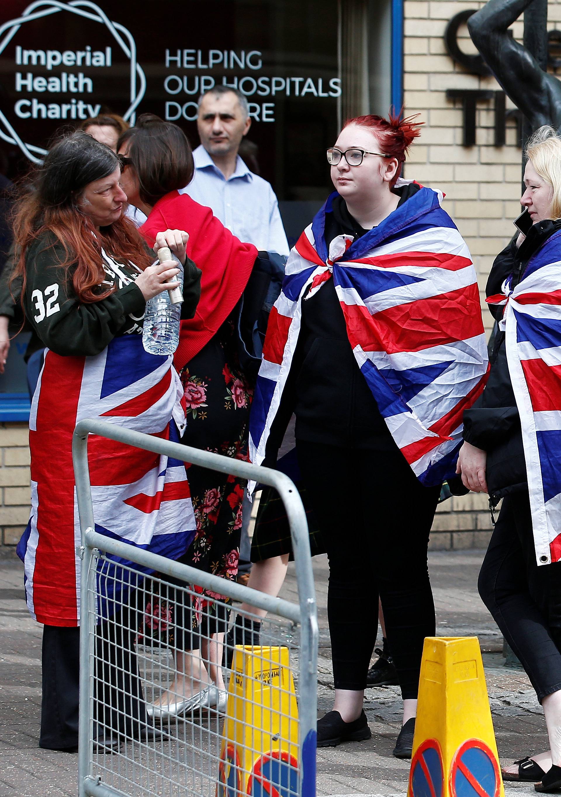 Supporters of the royal family stand outside the Lindo Wing of St Mary's Hospital after Britain's Catherine, the Duchess of Cambridge, was admitted after going into labour ahead of the birth of her third child, in London