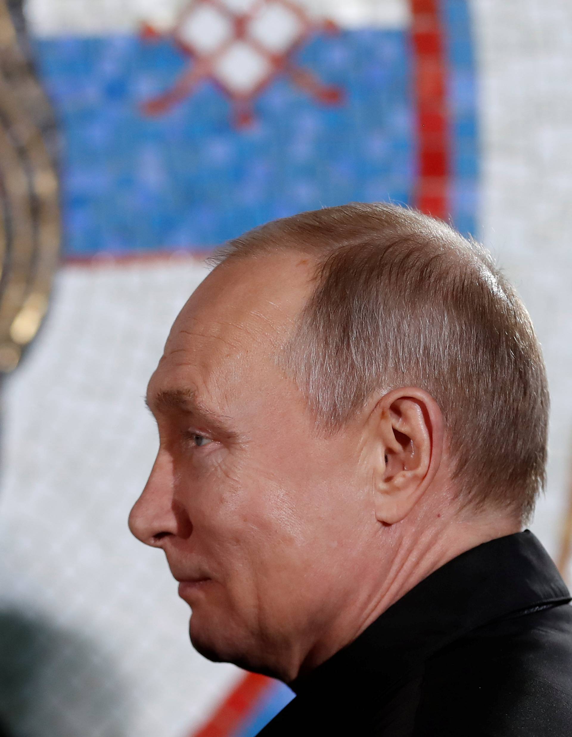 Russian President Vladimir Putin stands during his visit to the St Sava temple in Belgrade