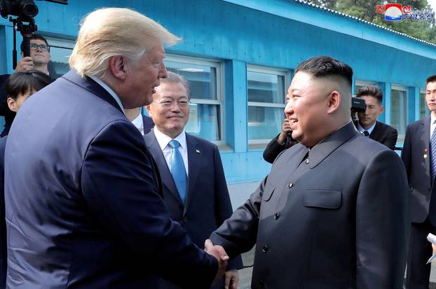 FILE PHOTO: Trump meets with North Korean leader Kim Jong Un at DMZ on border of North and South Korea
