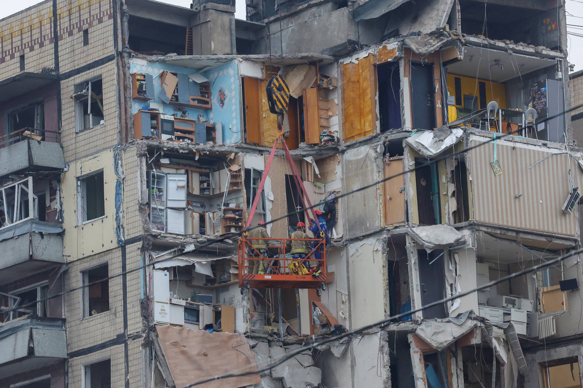 Aftermath of Dnipro apartment block destruction following missile strike