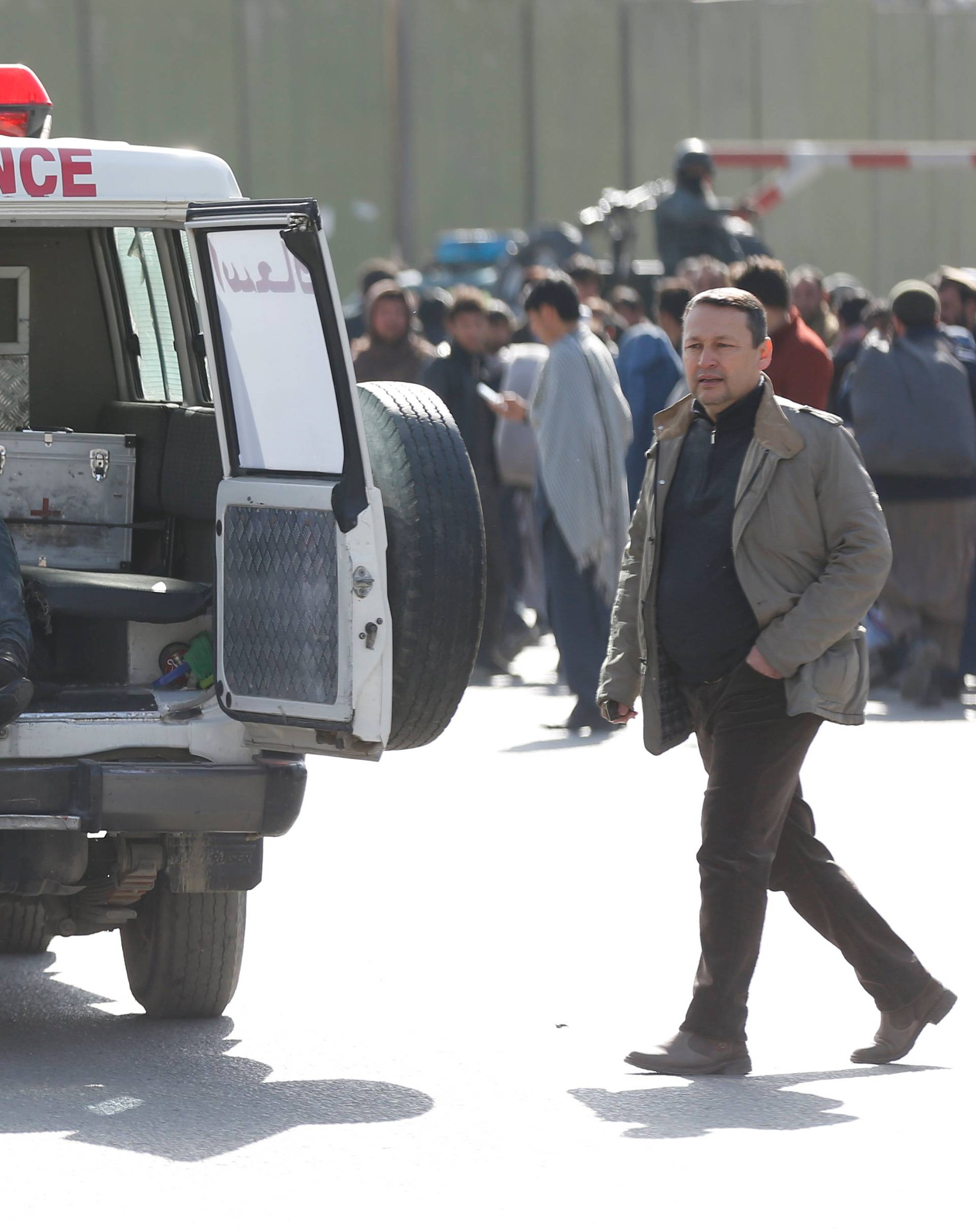 Victims are carried away in an ambulance after a blast in Kabul