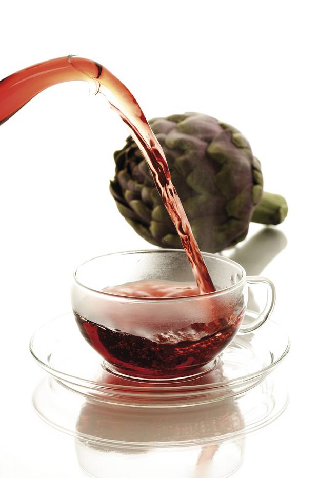 Tea being poured into tea cup, close-up