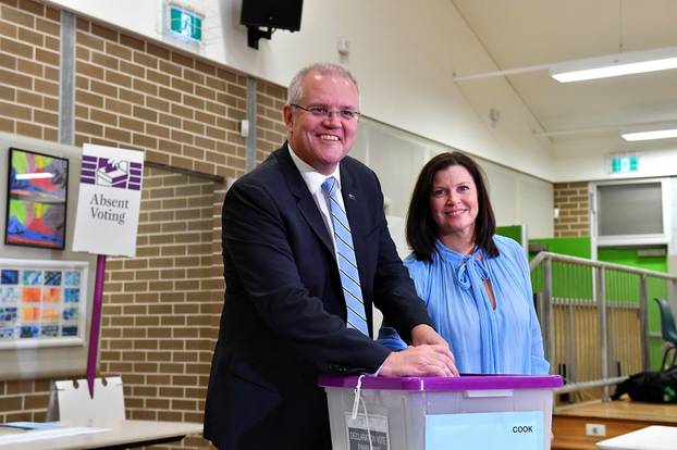 Australian Prime Minister Scott Morrison casts his vote alongside wife Jenny, on Election day, at Lilli Pilli Public School, in Sydney