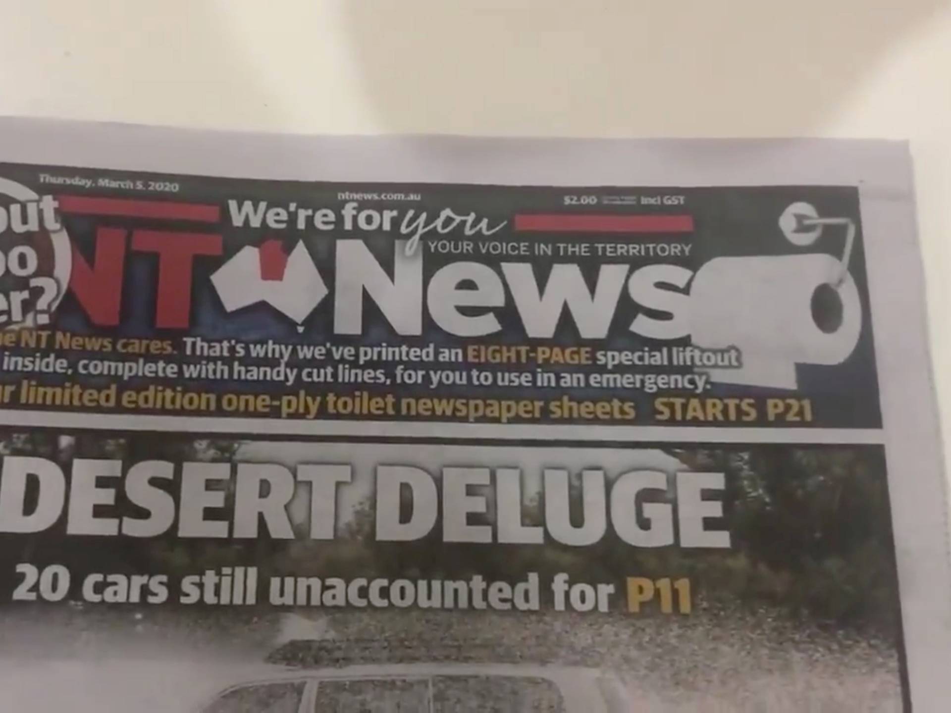 A headline of the Australian newspaper NT News is seen on their "toilet paper" edition containing pages with liftout and cut lines, in Darwin