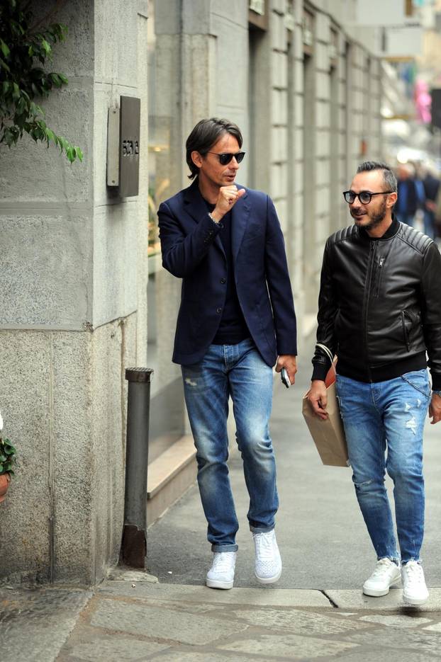 Milan, Filippo Inzaghi walking in the center with a friend