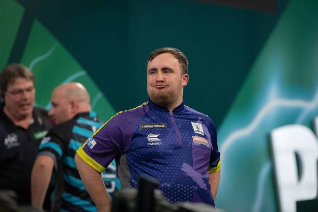 Darts 2024 PDC World Darts Championship Luke Littler (ENG) reacts after winning his semi-final match against Rob Cross (