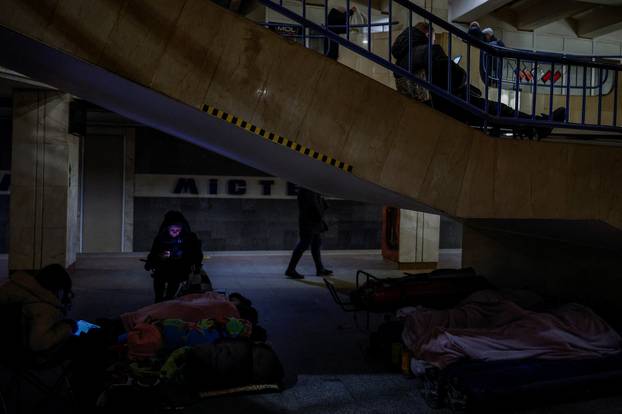 People take shelter inside a metro station during overnight Russian missile and drone attack, in Kyiv