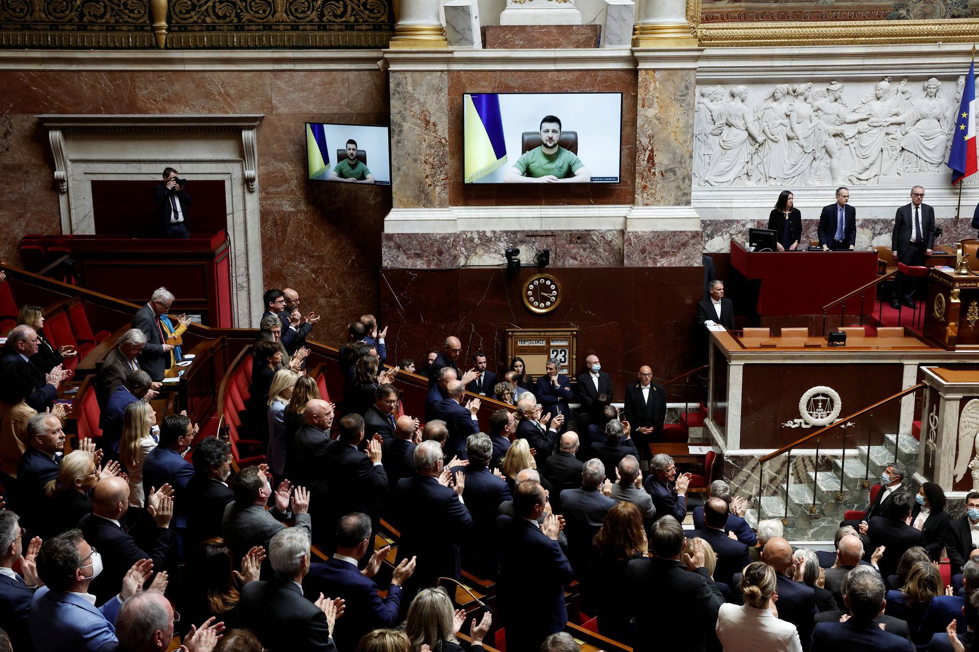Ukraine's President Zelenskiy addresses French lawmakers via video link, in Paris