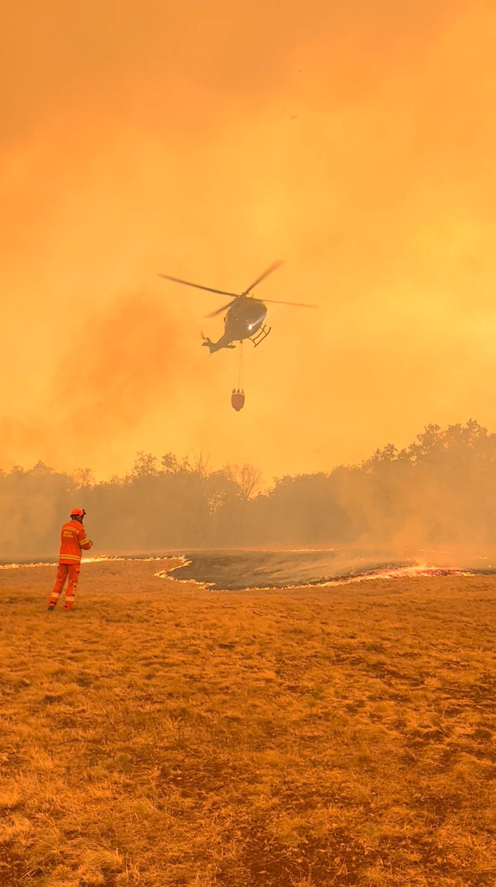 Firefighters try to extinguish a wildfire in Slovenia