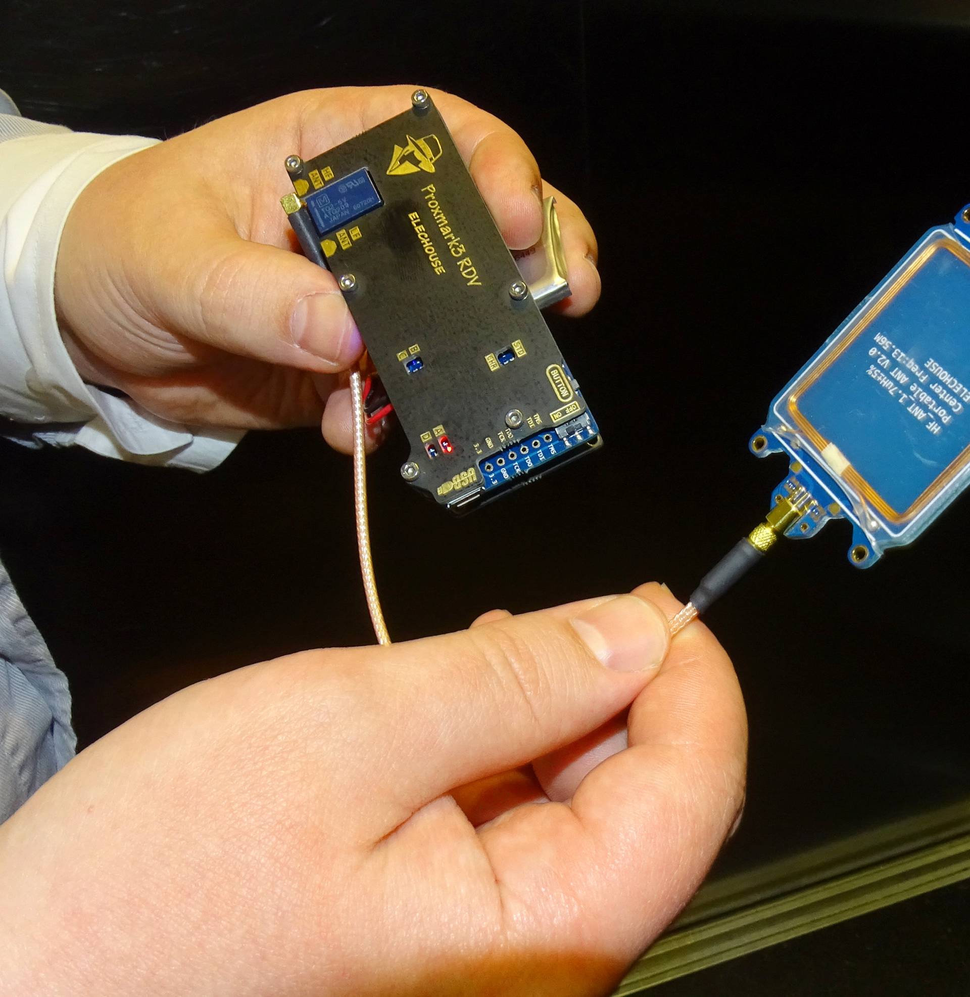 F-Secure researcher Hirvonen shows a device that is able to create a master key out of a single hotel key card in Helsinki