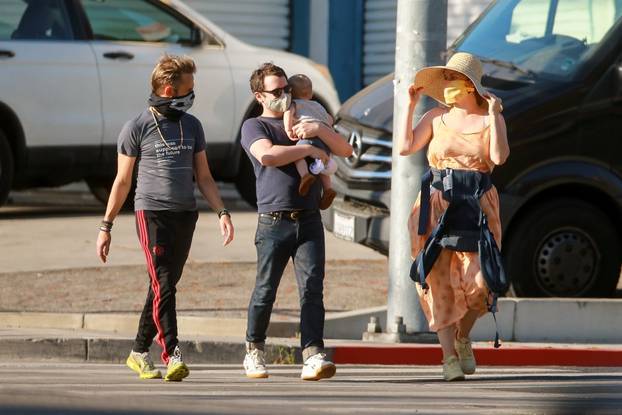 *EXCLUSIVE* Elijah Wood goes for a stroll with his baby and actor pal Dominic Monaghan