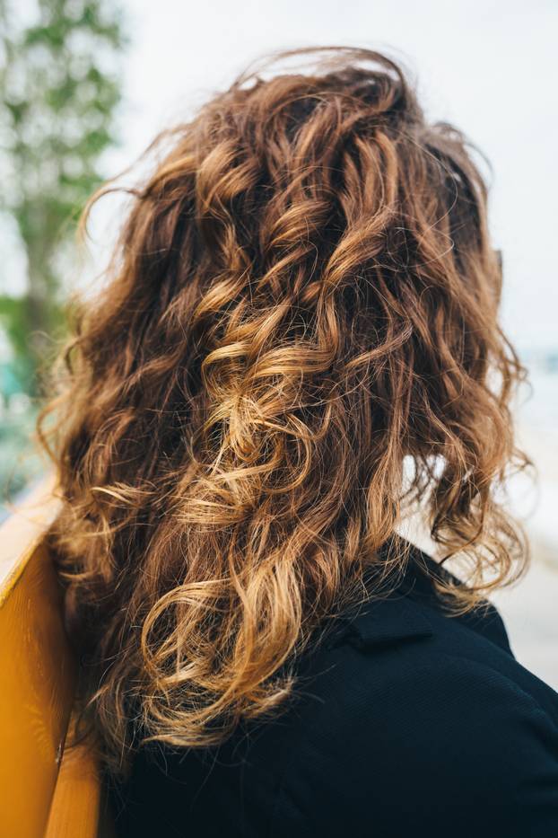Close-up of female's curly hair