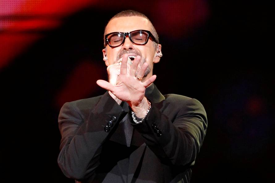 FILE PHOTO British singer George Michael performs on stage during his "Symphonica" tour concert in Berlin