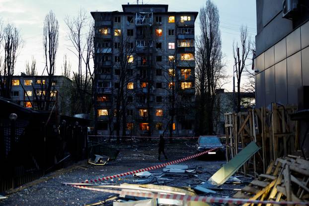 Rescuers work at the site of a Russian missile strike, amid Russia's attack on Ukraine, in Kyiv