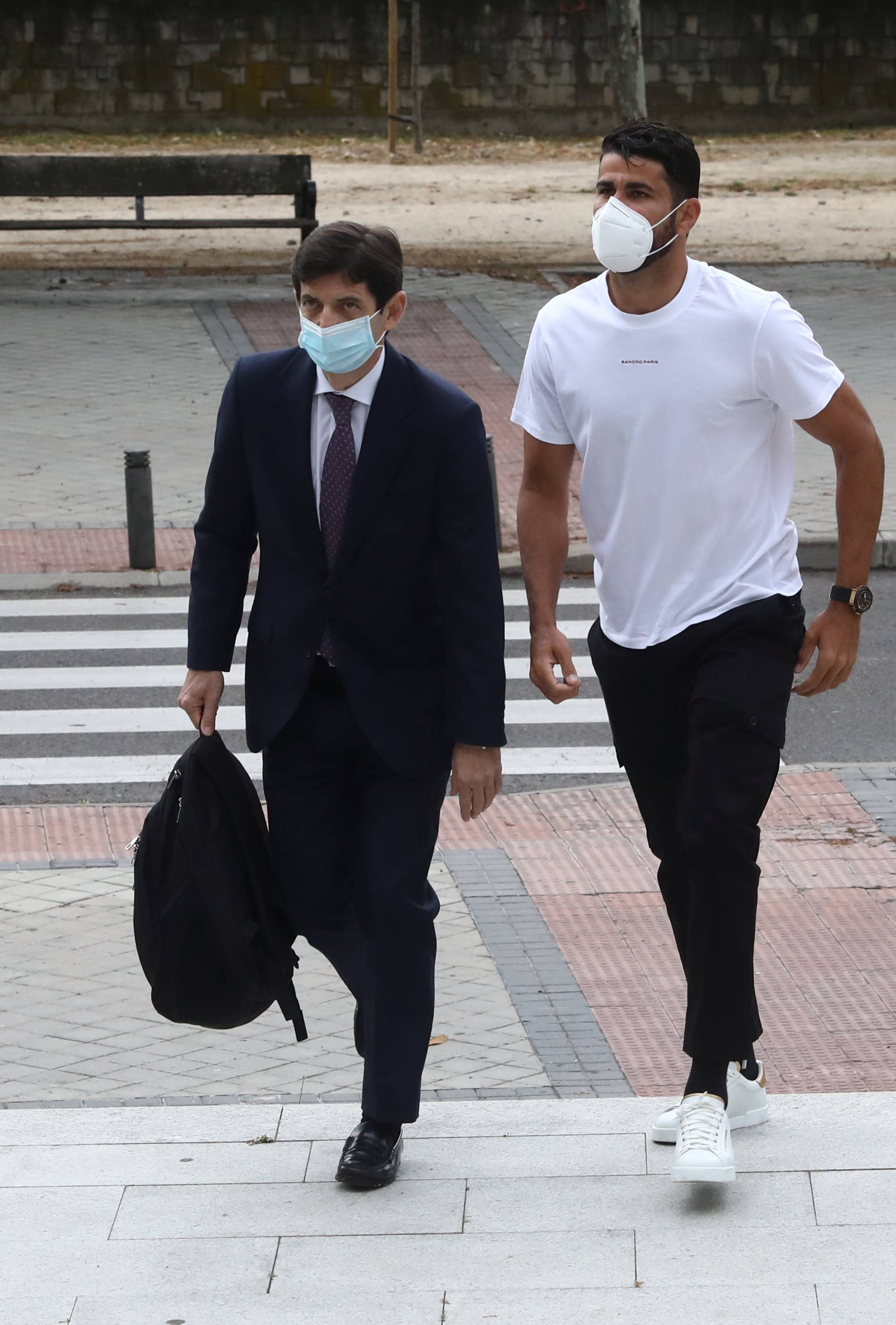 Atletico Madrid's Diego Costa arrives at a court to attend a trial for tax fraud